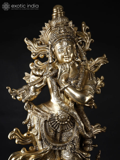 KrishnaÕs Inimitable Magnificence (Large Murli Manohar Lord Krishna Brass Statue Standing on Lotus with Peacock)