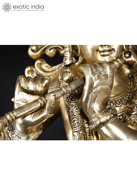 KrishnaÕs Inimitable Magnificence (Large Murli Manohar Lord Krishna Brass Statue Standing on Lotus with Peacock)