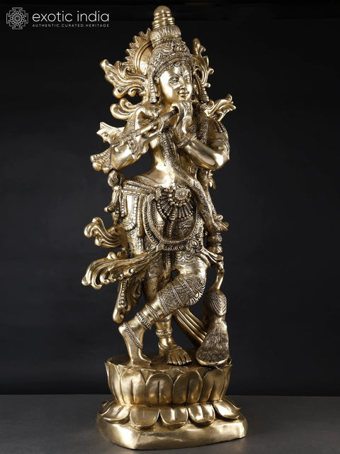 KrishnaÕs Inimitable Magnificence (Large Murli Manohar Lord Krishna Brass Statue Standing on Lotus with Peacock)