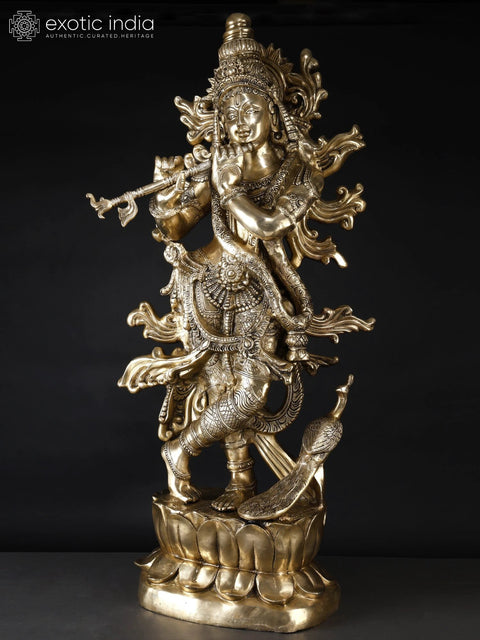 KrishnaÕs Inimitable Magnificence (Large Murli Manohar Lord Krishna Brass Statue Standing on Lotus with Peacock)