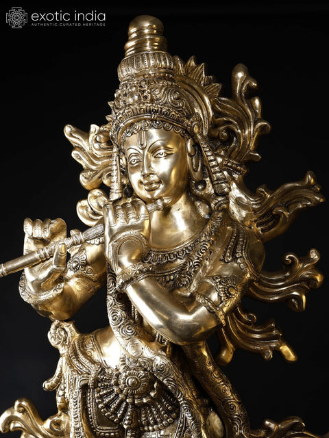 KrishnaÕs Inimitable Magnificence (Large Murli Manohar Lord Krishna Brass Statue Standing on Lotus with Peacock)
