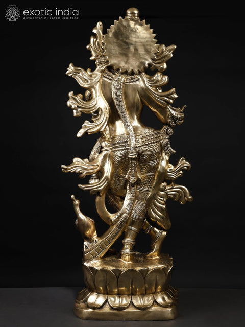 KrishnaÕs Inimitable Magnificence (Large Murli Manohar Lord Krishna Brass Statue Standing on Lotus with Peacock)