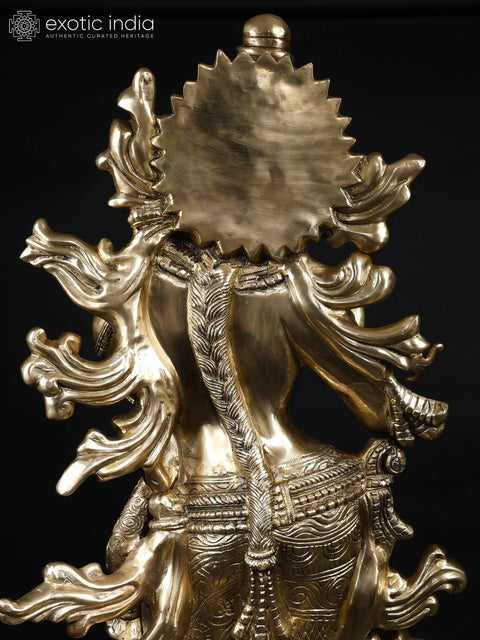 KrishnaÕs Inimitable Magnificence (Large Murli Manohar Lord Krishna Brass Statue Standing on Lotus with Peacock)