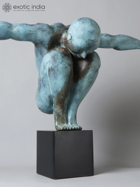 Equilibrium’s Edge: The Olympic Swimmer | Brass Sculpture from Indonesia