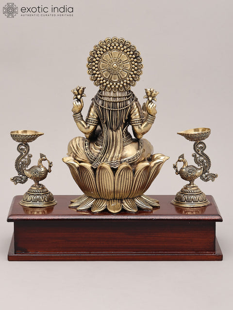 9" Superfine Four Armed Goddess Lakshmi with Peacock Lamp and Wood Base | Brass Idol