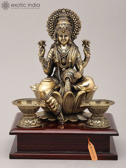 7" Superfine Seated Goddess Dhanalakshmi with Oil Lamps and Wood Base | Brass Sculpture