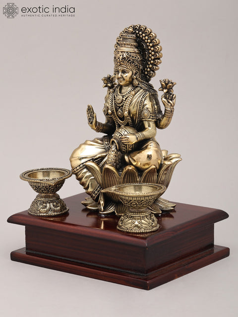 7" Superfine Seated Goddess Dhanalakshmi with Oil Lamps and Wood Base | Brass Sculpture