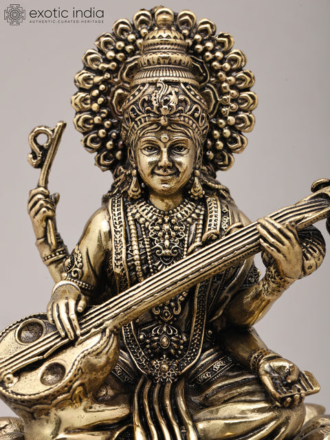 Superfine Seated Four Armed Goddess Saraswati with Wood Base | Brass Idol