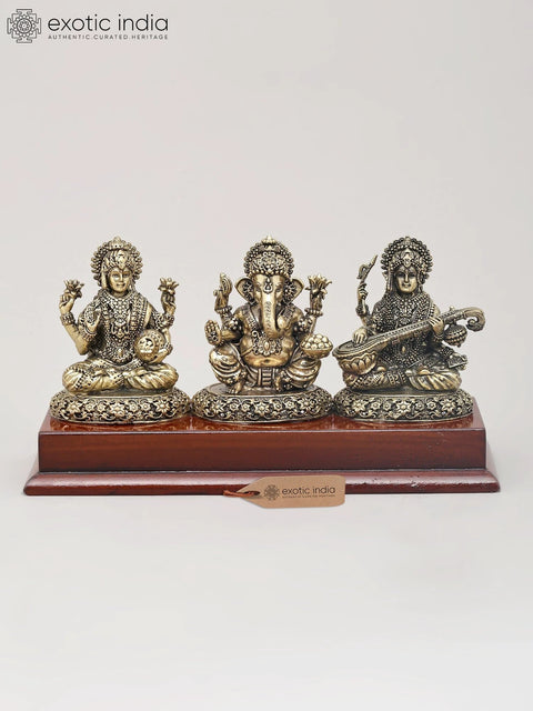 7" Superfine Trio of Goddess Lakshmi, Lord Ganesha and Goddess Saraswati with Wood Base | Brass Idol