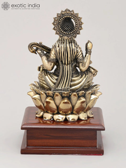 7" Superfine Chaturbhuja Goddess Saraswati Seated on Lotus with Wood Base | Brass Sculpture