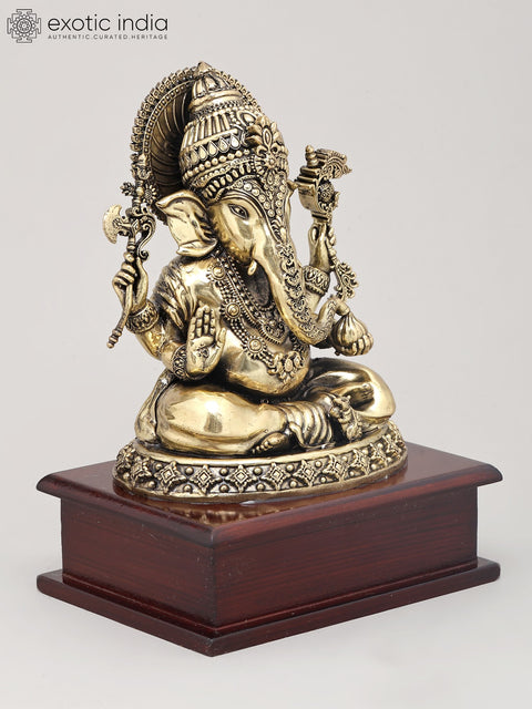 8" Superfine Chaturbhuja Lord Ganapati Holding Modak on Wood Base | Brass Statue
