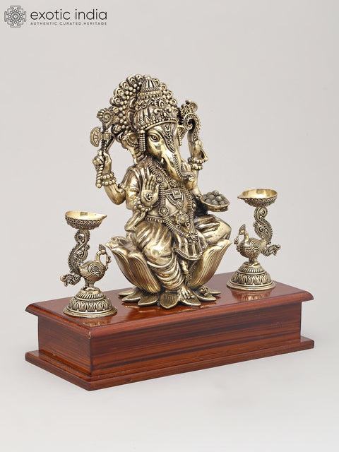 9" Superfine Lord Ganesha Seated on Lotus with Oil Lamps and Wood Base | Brass Sculpture