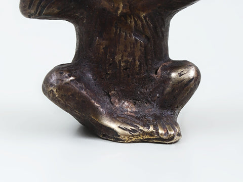 Small Brass Monkey Holding a Leaf Over Its Head