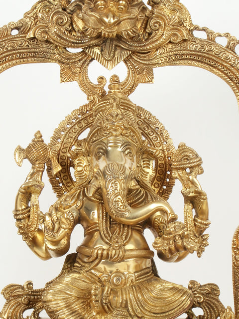 22" Superfine Brass Lord Ganapati Seated on Kirtimukha Throne with Goddess Lakshmi and Goddess Saraswati