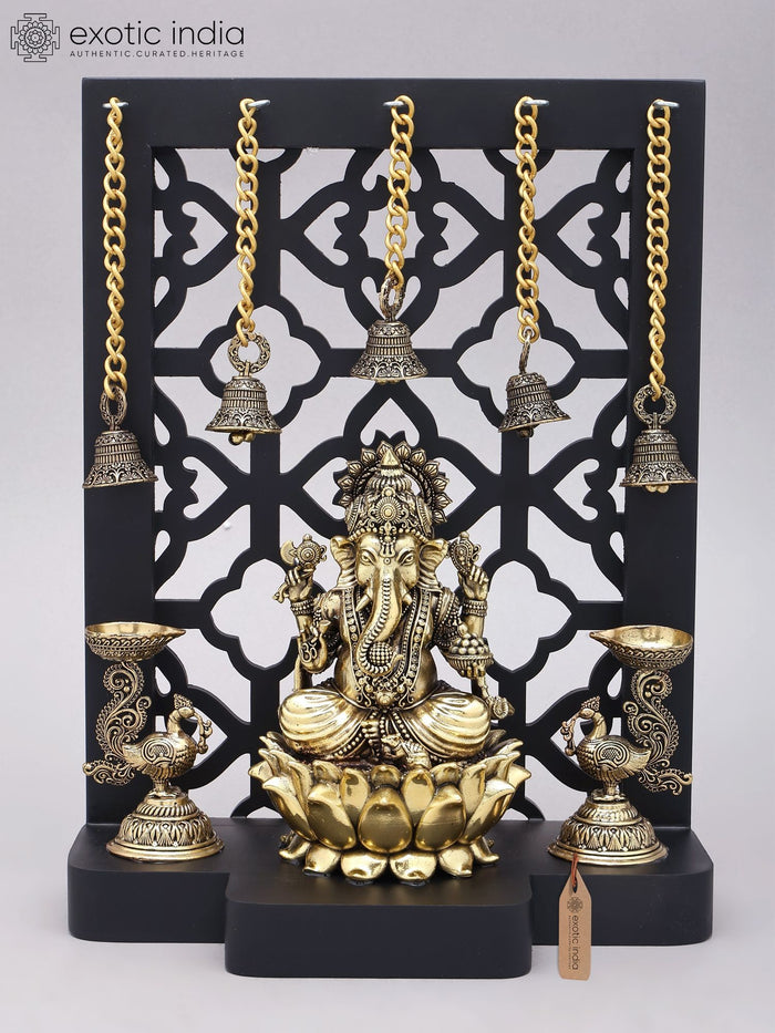 12" Brass Ganapati Statue with Jali Wood Frame and Peacock Lamps