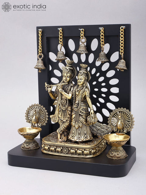 12" Superfine Divine Pair of Radha Krishna with Peacock Lamps and Bells | Brass Statue with Designer Wood Frame