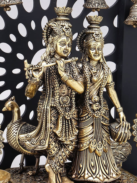 12" Superfine Divine Pair of Radha Krishna with Peacock Lamps and Bells | Brass Statue with Designer Wood Frame