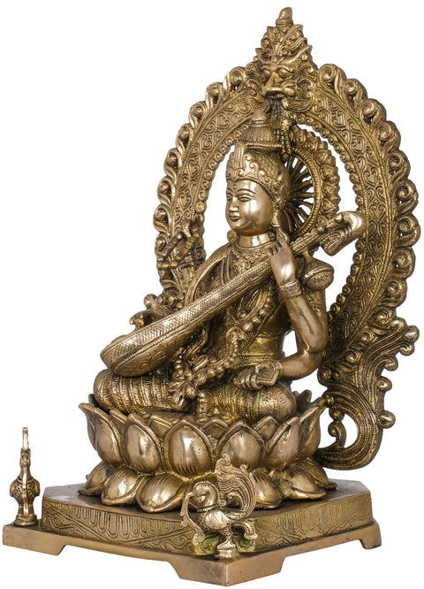 16" Goddess Saraswati Seated on Lotus Seat with Kirtimukha Aureole in Brass | Handmade | Made in India