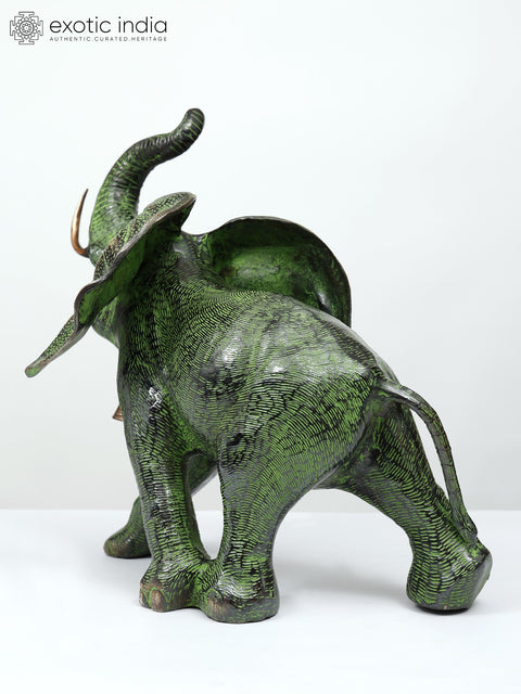 15" A Young Trumpeting Elephant With Long Tusks in Brass