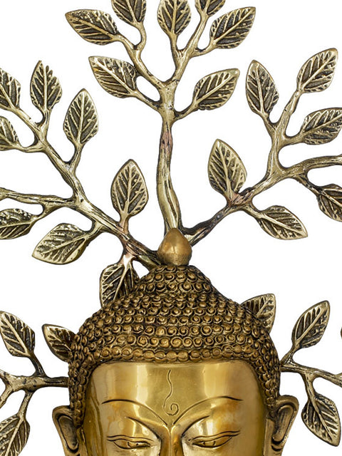 Lord Buddha Mask On a Wooden Base and Tree as a Backdrop