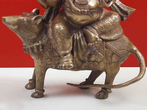 23" Ganesha Seated on His Rat Wearing a Leafy Crown In Brass