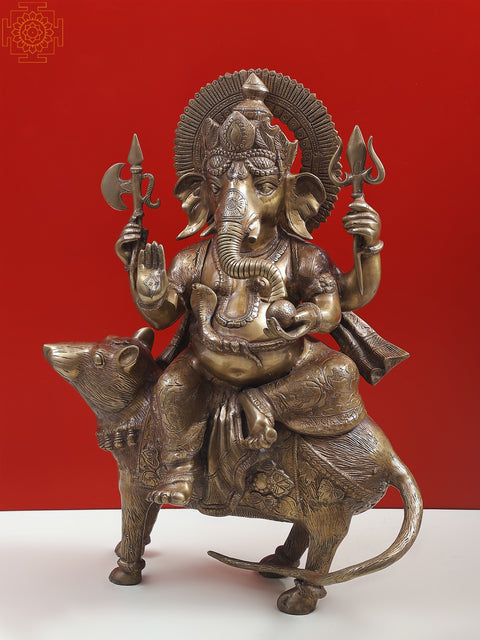 23" Ganesha Seated on His Rat Wearing a Leafy Crown In Brass