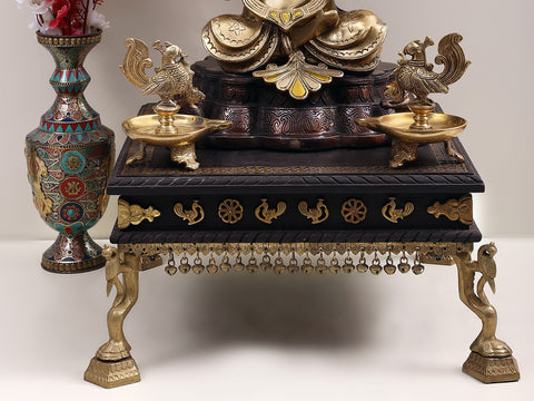 Wooden pedestal with Brass Ghungroos, Figures and Parrot Legs