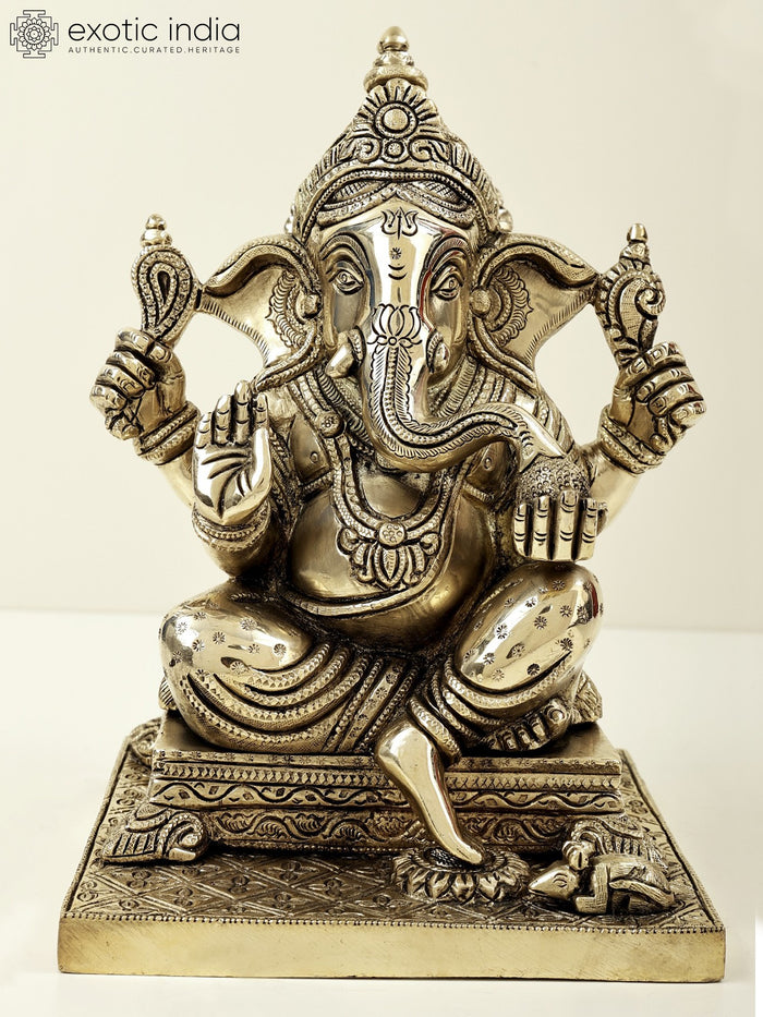 9" Lord Ganesha Seated on Pedestal and Eating Modak | Brass Bhagawan Ganesha | Brass Statue | Handmade | Made In India