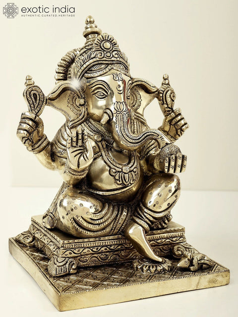 9" Lord Ganesha Seated on Pedestal and Eating Modak | Brass Bhagawan Ganesha | Brass Statue | Handmade | Made In India